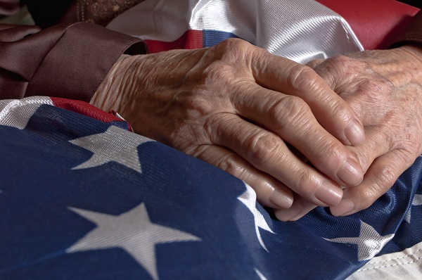 Hands holding an American flag