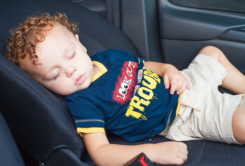 child asleep in car