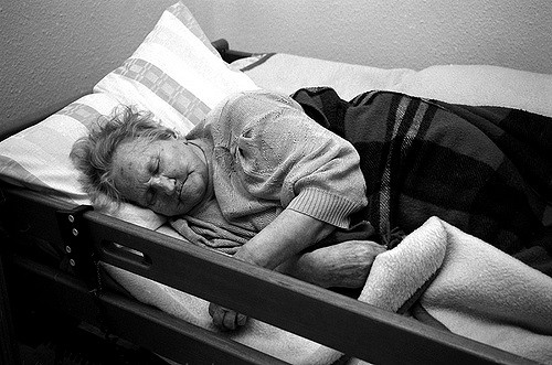 senior patient in nursing home bed