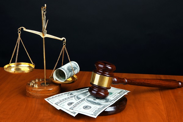 scales of justice with money