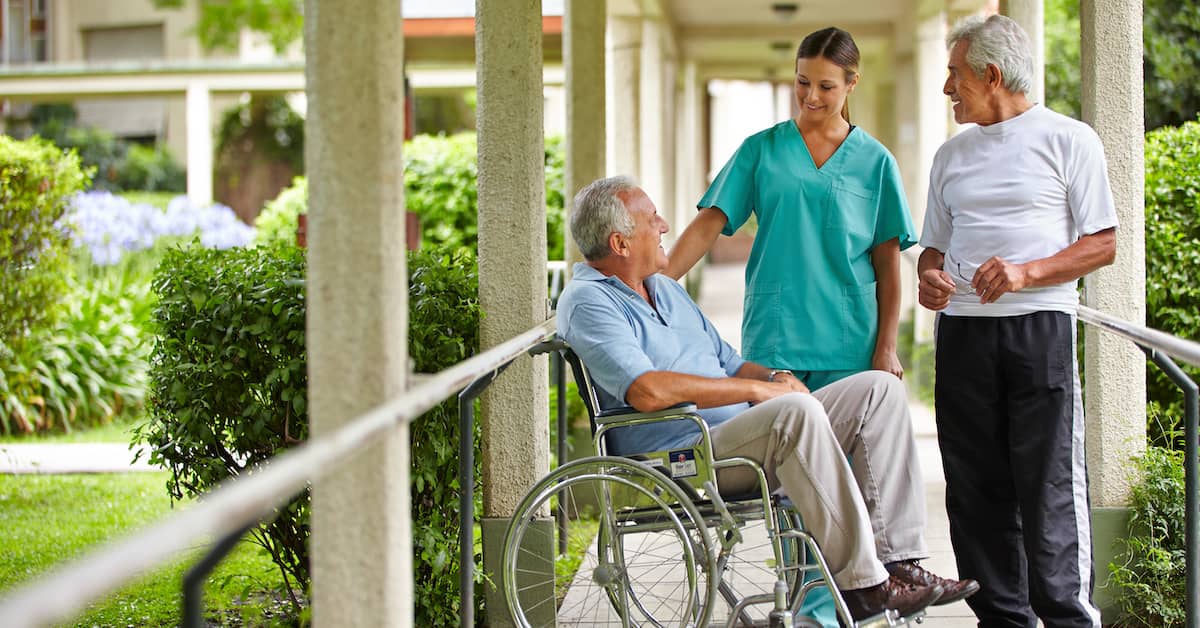 nurse helps patient in nursing home | Boller and Vaughan